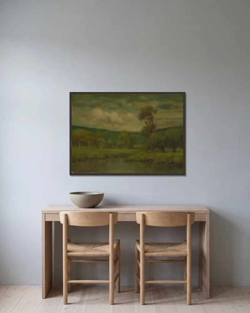 Landskap av George Inness inramad på en vägg