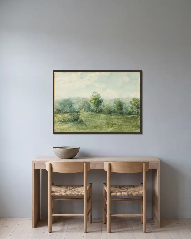 Landskap av George Inness inramad på en vägg