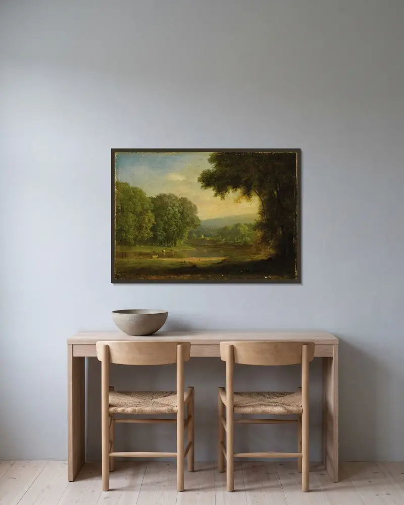 Landskap av George Inness inramad på en vägg