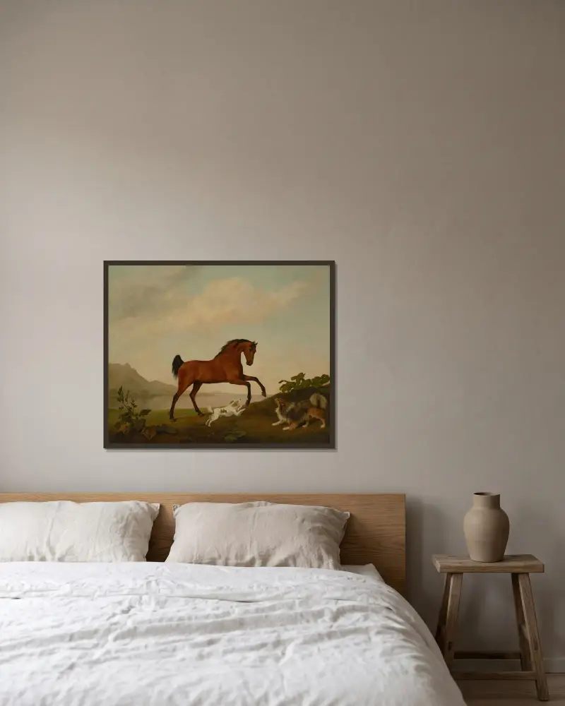 En stegrande häst med två hundar, i ett landskap av George Stubbs inramad på en vägg