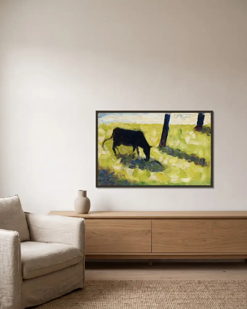 Black Cow in a Meadow av Georges Seurat inramad på en vägg