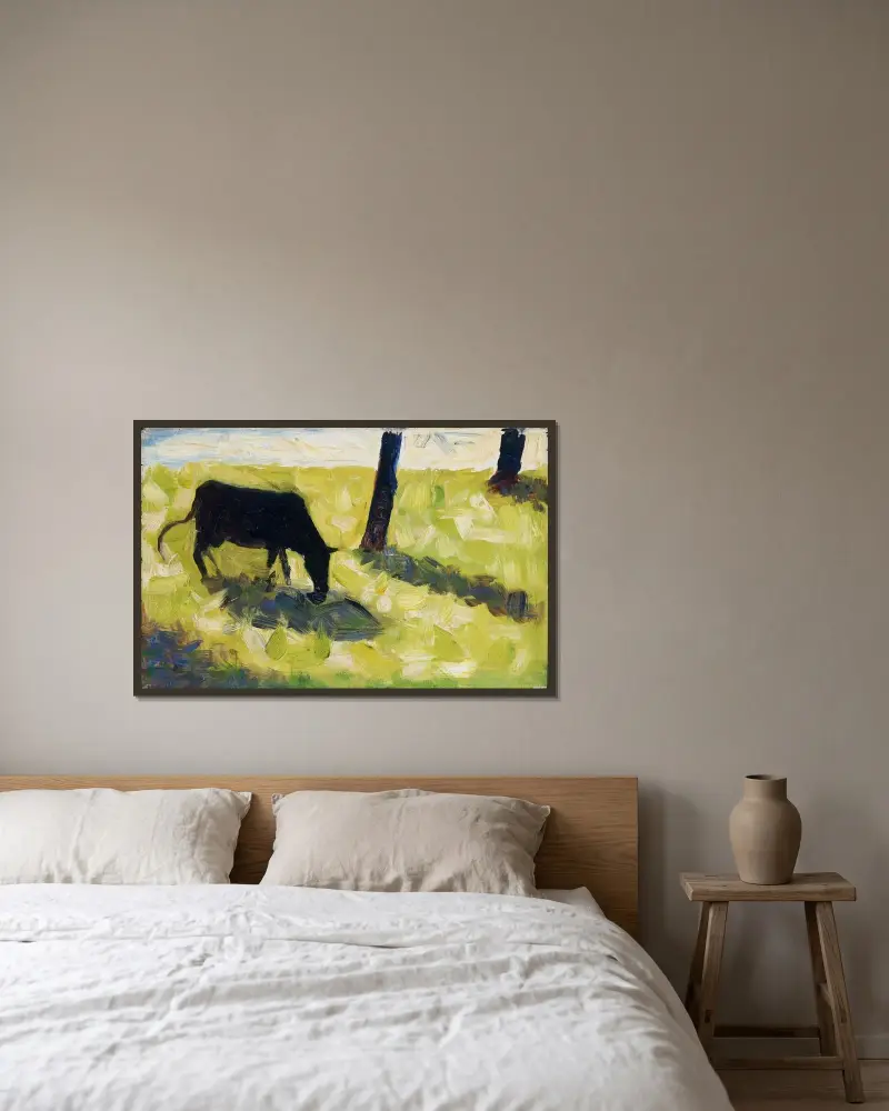 Black Cow in a Meadow av Georges Seurat inramad på en vägg