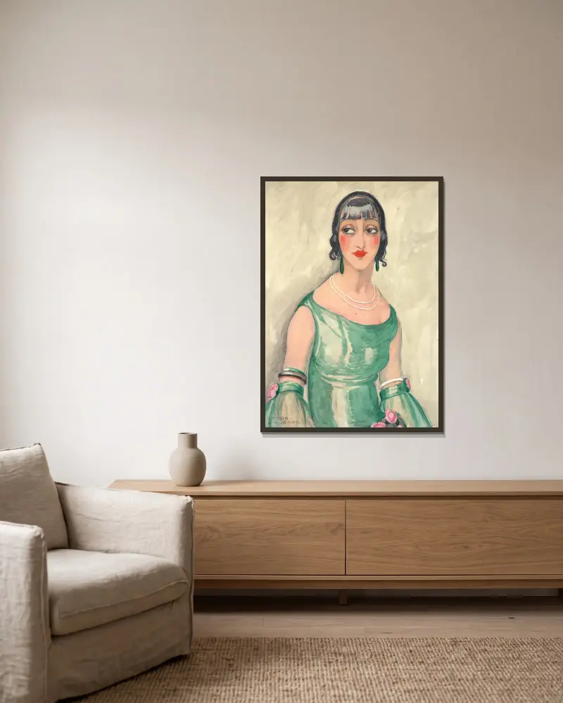Portrait of a woman in green dress and pearls av Gerda Wegener inramad på en vägg