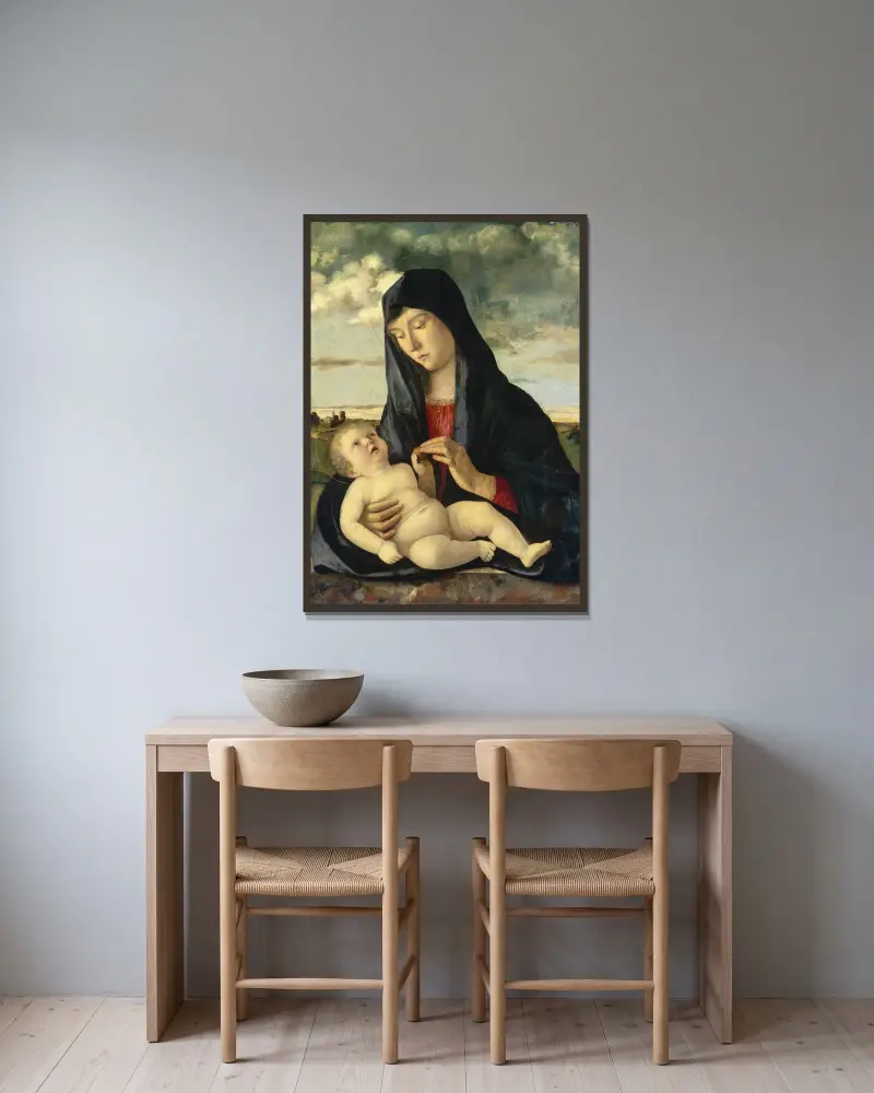 Madonna and Child in a Landscape av Giovanni Bellini inramad på en vägg