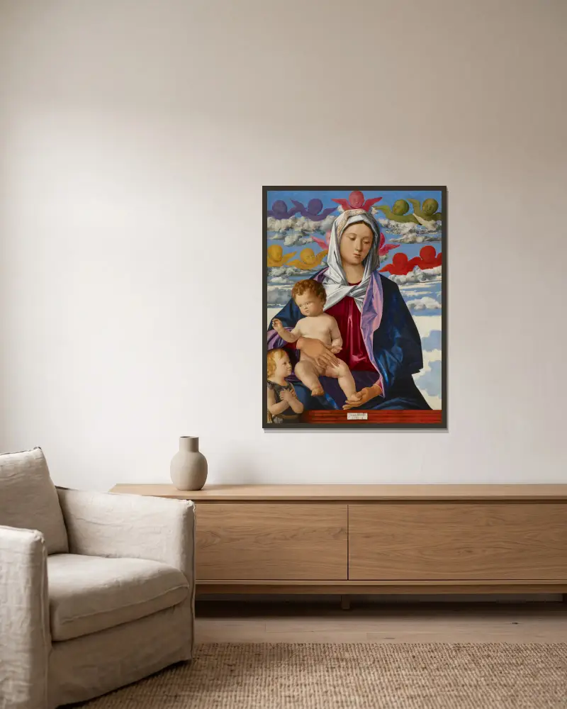 Madonna mit Kind und Johannes dem Täufer von Giovanni Bellini gerahmt an einer Wand