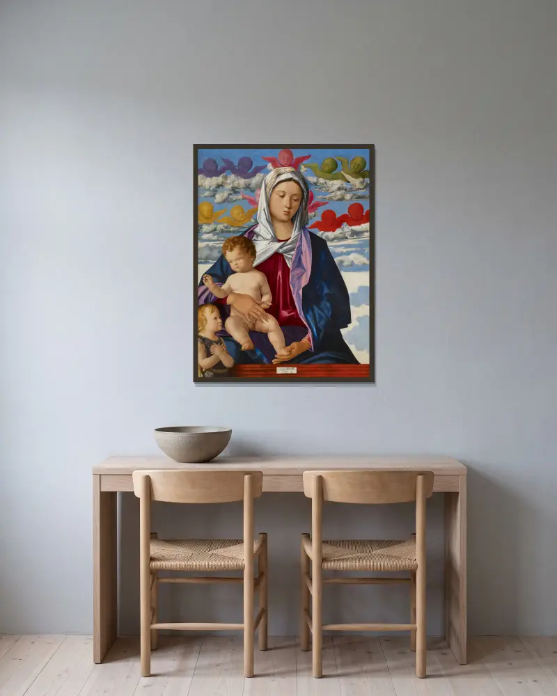 Madonna mit Kind und Johannes dem Täufer von Giovanni Bellini gerahmt an einer Wand
