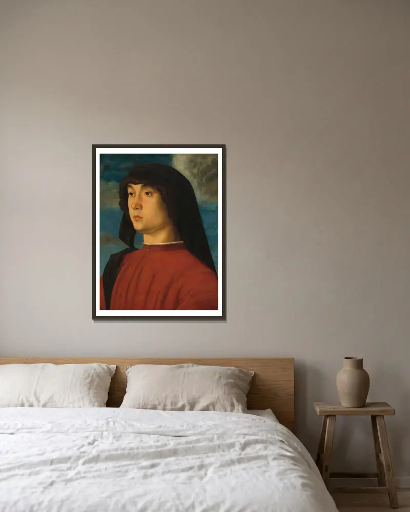 Portrait of a Young Man in Red av Giovanni Bellini inramad på en vägg