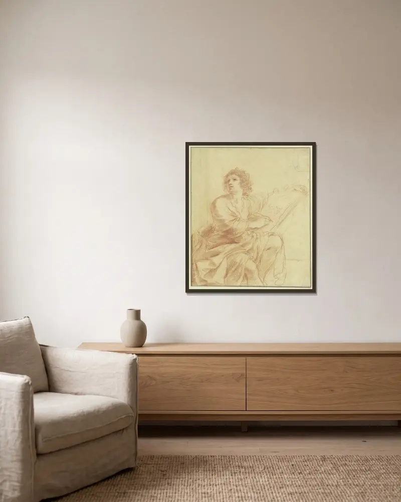 Johannes evangelisten, sittande och skrivande av Guercino inramad på en vägg