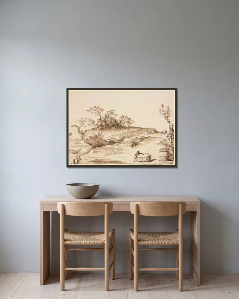 Landskap med en man som lutar sig mot en bal av Guercino inramad på en vägg
