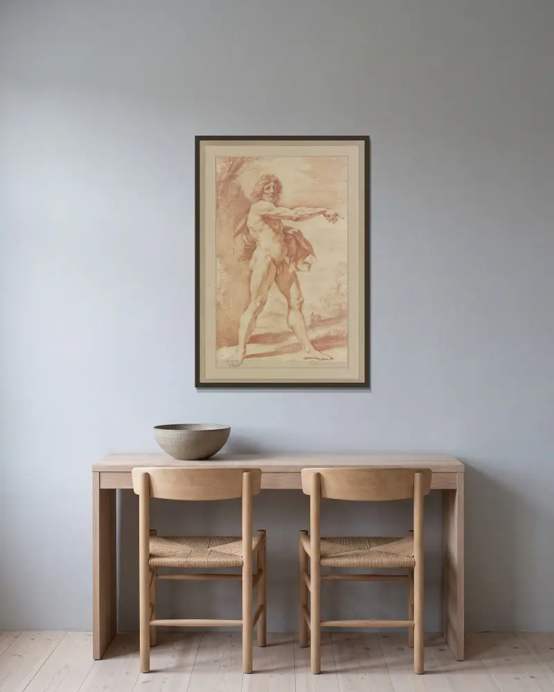 Naken man bärande ett plagg under armen, pekande åt höger av Guercino inramad på en vägg