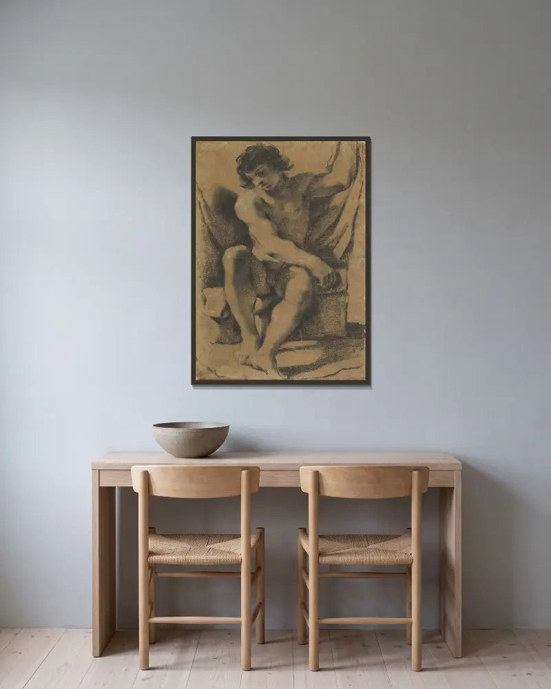 Sittande naken ung man i nästan frontal vy av Guercino inramad på en vägg