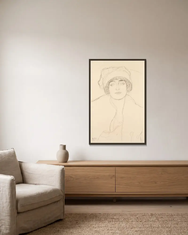 Podobizna v klobouku av Gustav Klimt inramad på en vägg