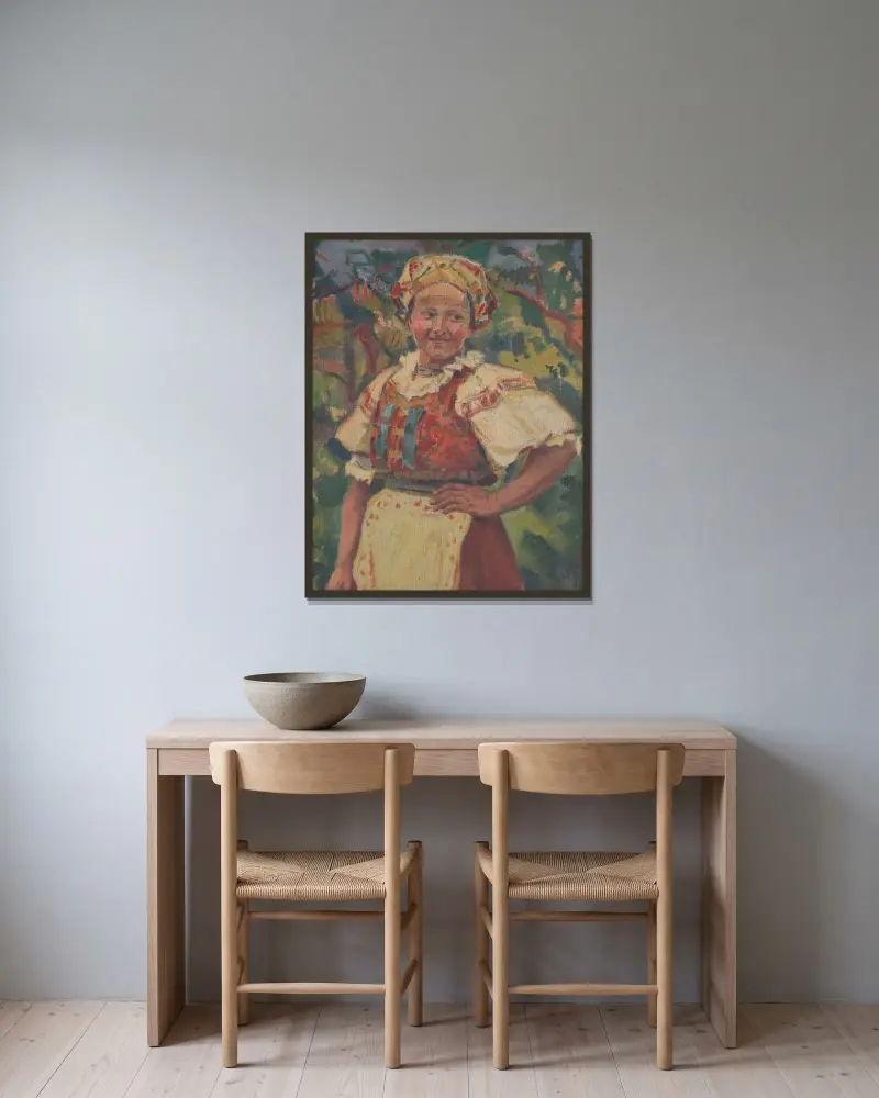 Kvinna i folkdräkt av Gustáv Mallý inramad på en vägg