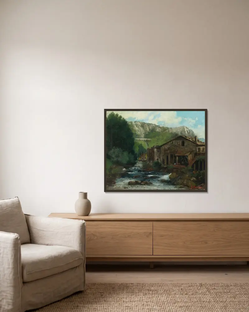 En kvarn i ett klipplandskap av Gustave Courbet inramad på en vägg