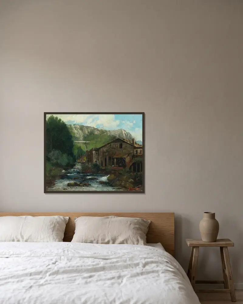 En kvarn i ett klipplandskap av Gustave Courbet inramad på en vägg