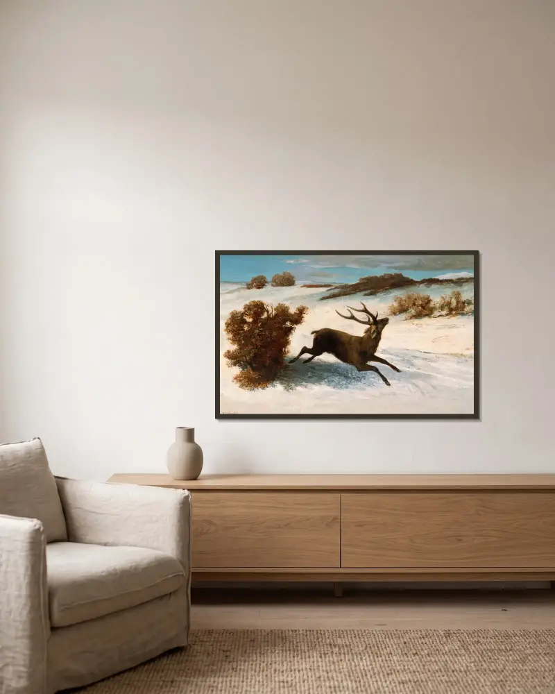 Hjort som springer i snön av Gustave Courbet inramad på en vägg