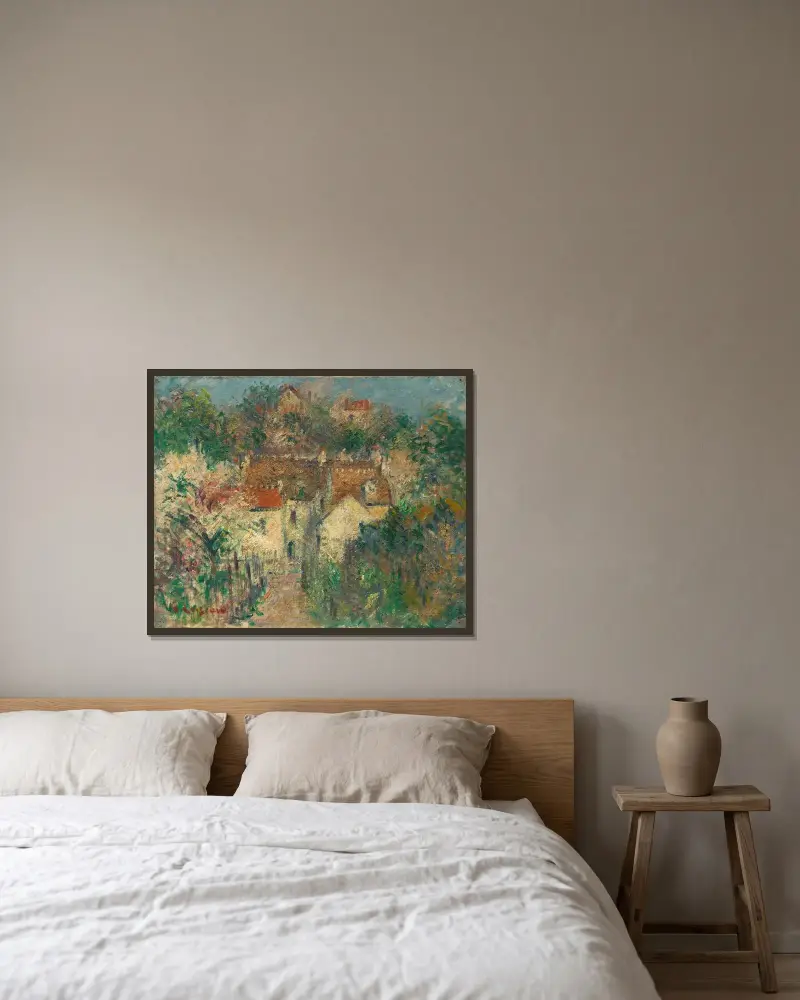 Vy av by av Gustave Loiseau inramad på en vägg