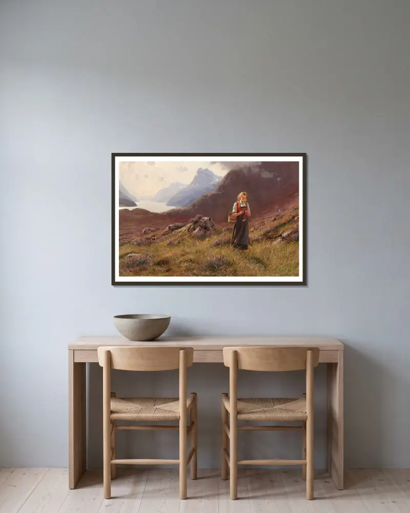A girl knitting in a Norwegian landscape av Hans Dahl inramad på en vägg