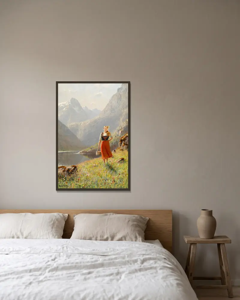 A young girl with a basket in the mountains av Hans Dahl inramad på en vägg