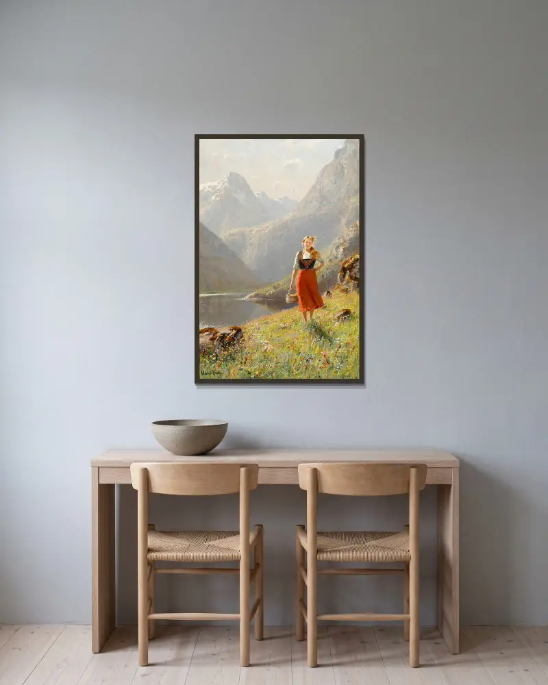 A young girl with a basket in the mountains av Hans Dahl inramad på en vägg