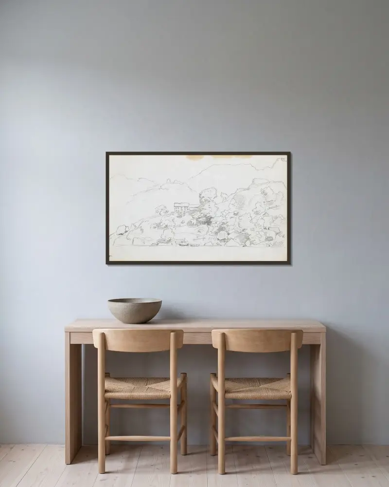 Kystlandskap med hus av Hans Gude inramad på en vägg