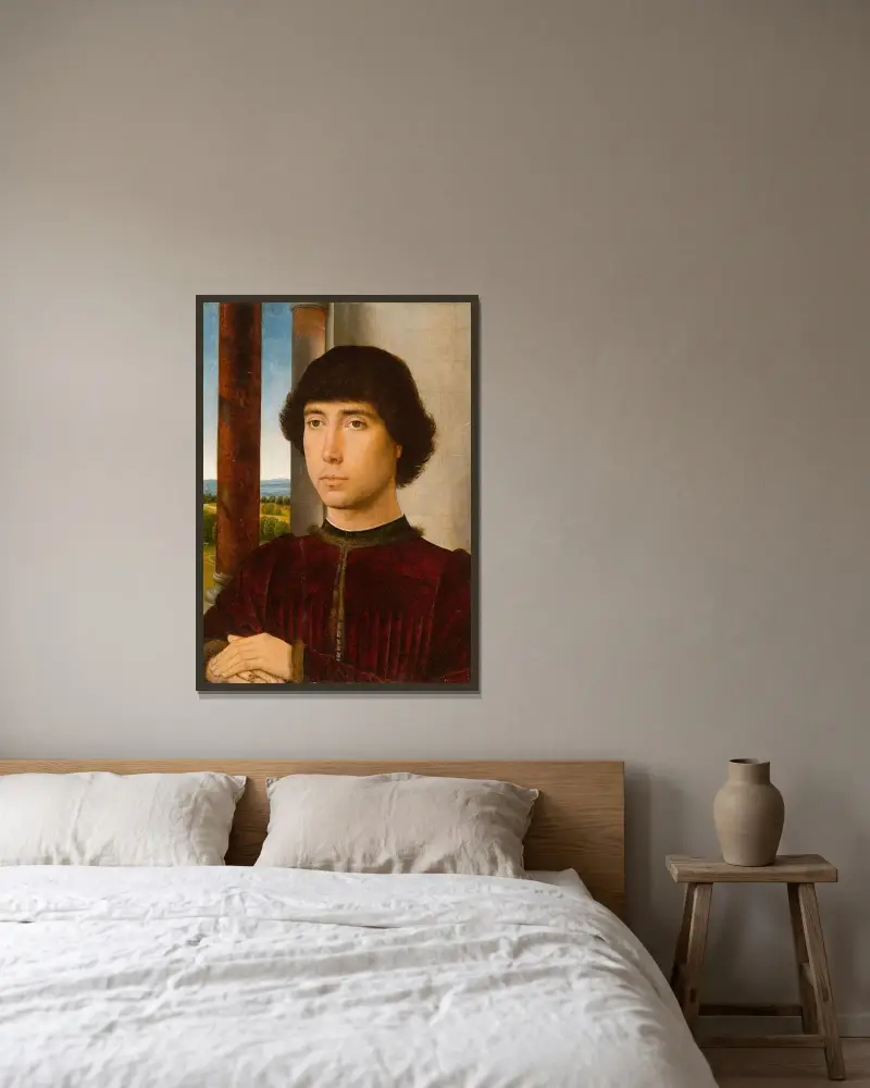 Porträtt av en ung man av Hans Memling inramad på en vägg