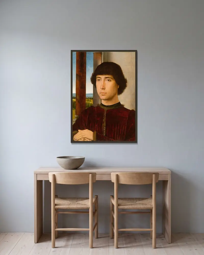 Porträtt av en ung man av Hans Memling inramad på en vägg