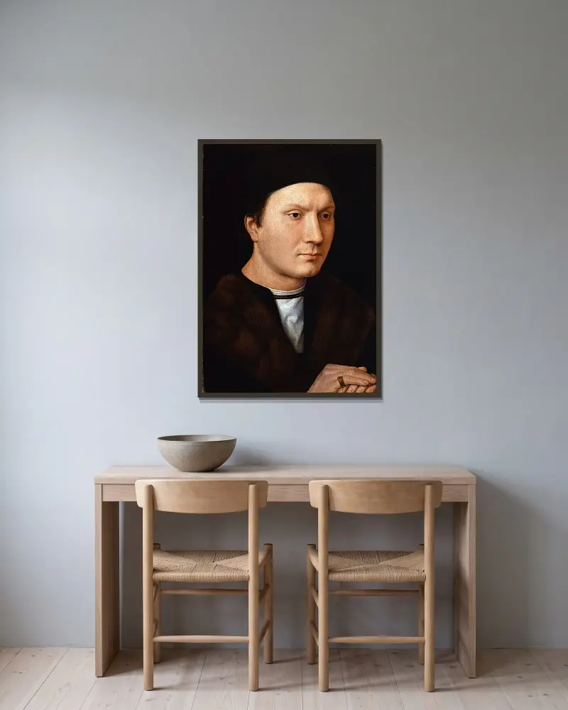 Porträtt av en okänd man av Hans Memling inramad på en vägg