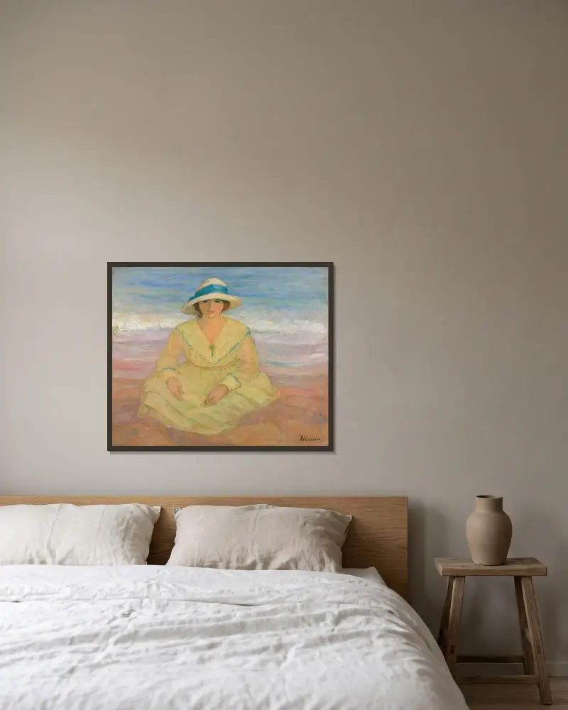 Ung flicka sittande på stranden av Henri Lebasque inramad på en vägg