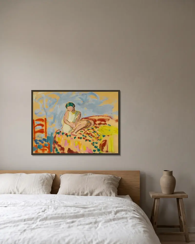 Ung flicka med grön turban sittande på en soffa av Henri Lebasque inramad på en vägg