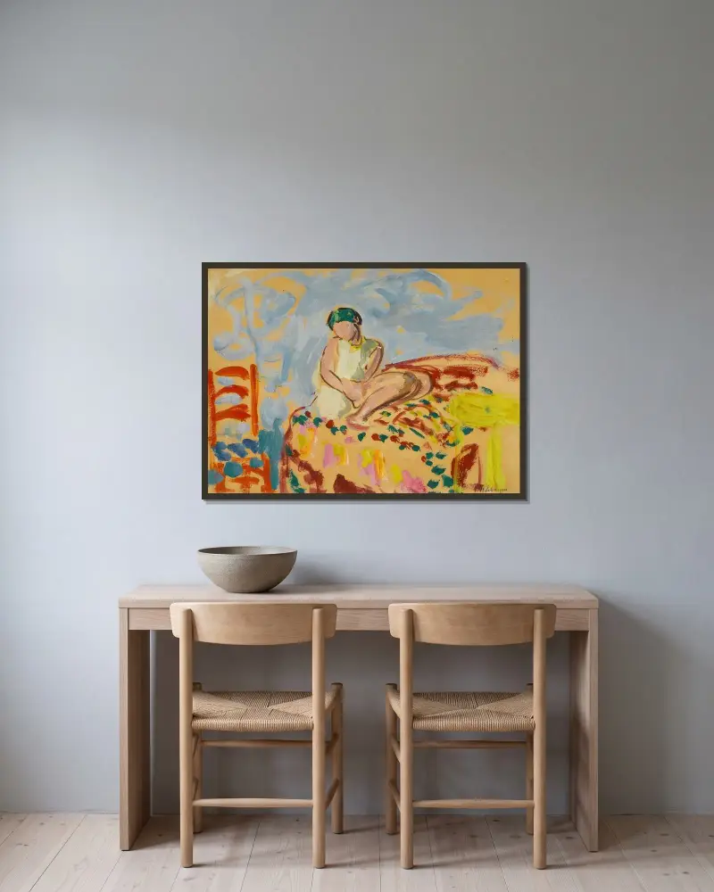 Ung flicka med grön turban sittande på en soffa av Henri Lebasque inramad på en vägg
