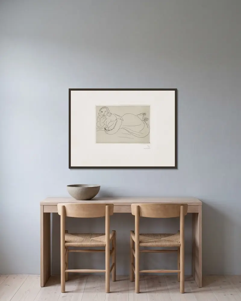 Jeune femme au repos av Henri Matisse inramad på en vägg