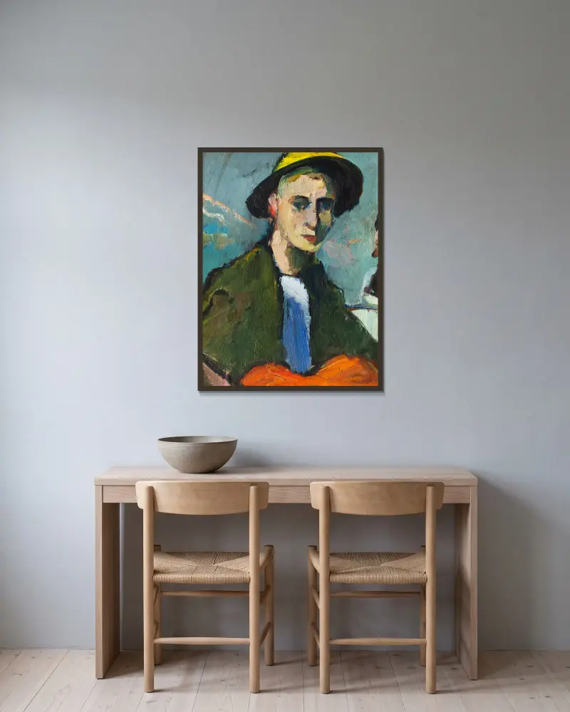 Selbstbildnis mit gelbem Hut von Hermann Stenner gerahmt an einer Wand