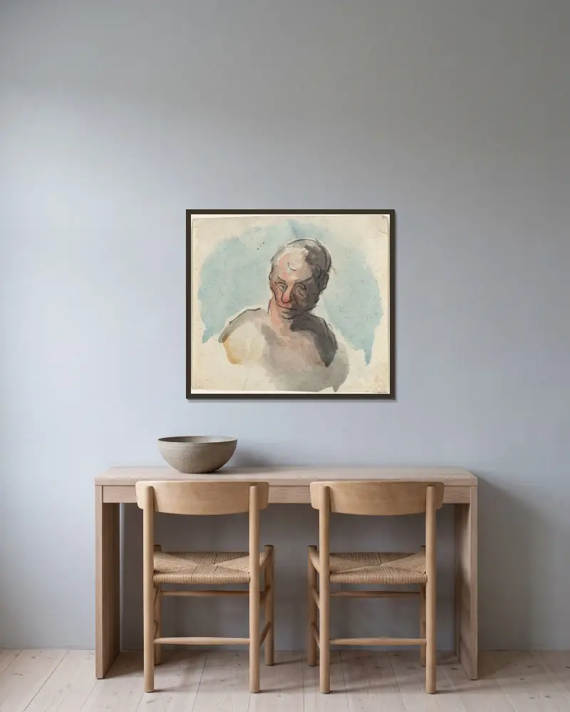 Manshuvud av Honoré Daumier inramad på en vägg