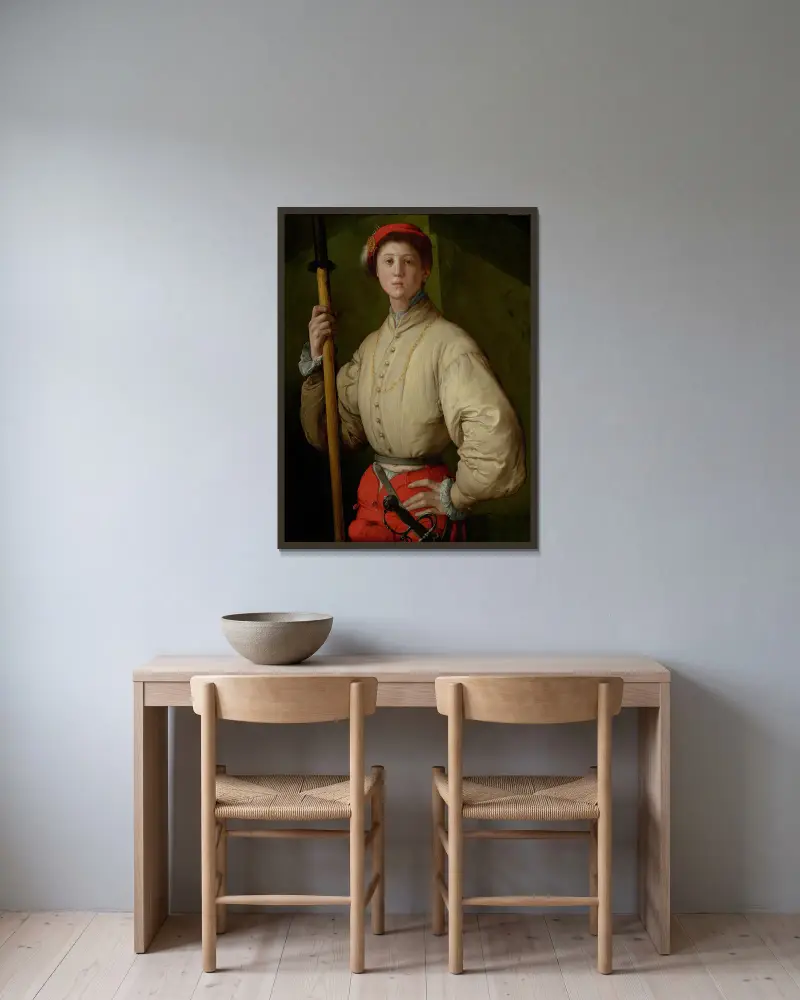 Portrait of a Halberdier av Pontormo (Jacopo Carucci) inramad på en vägg