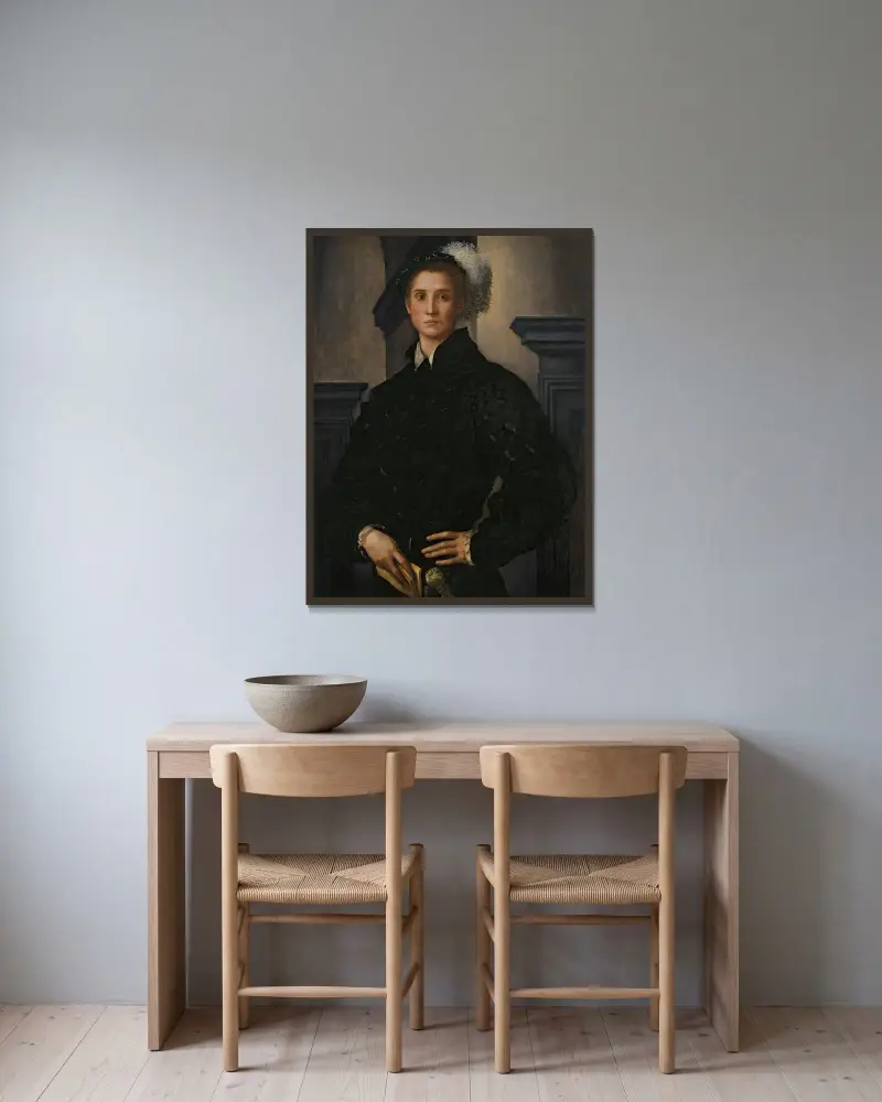 Portrait Of Cosimo I De Medici av Pontormo (Jacopo Carucci) inramad på en vägg