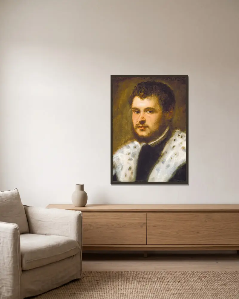 Junger Mann mit Bart von Jacopo Tintoretto gerahmt an einer Wand
