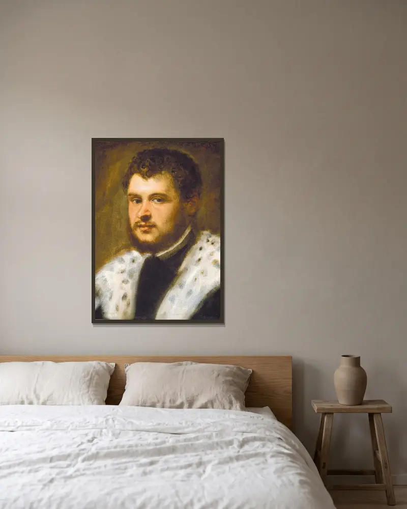 Junger Mann mit Bart von Jacopo Tintoretto gerahmt an einer Wand