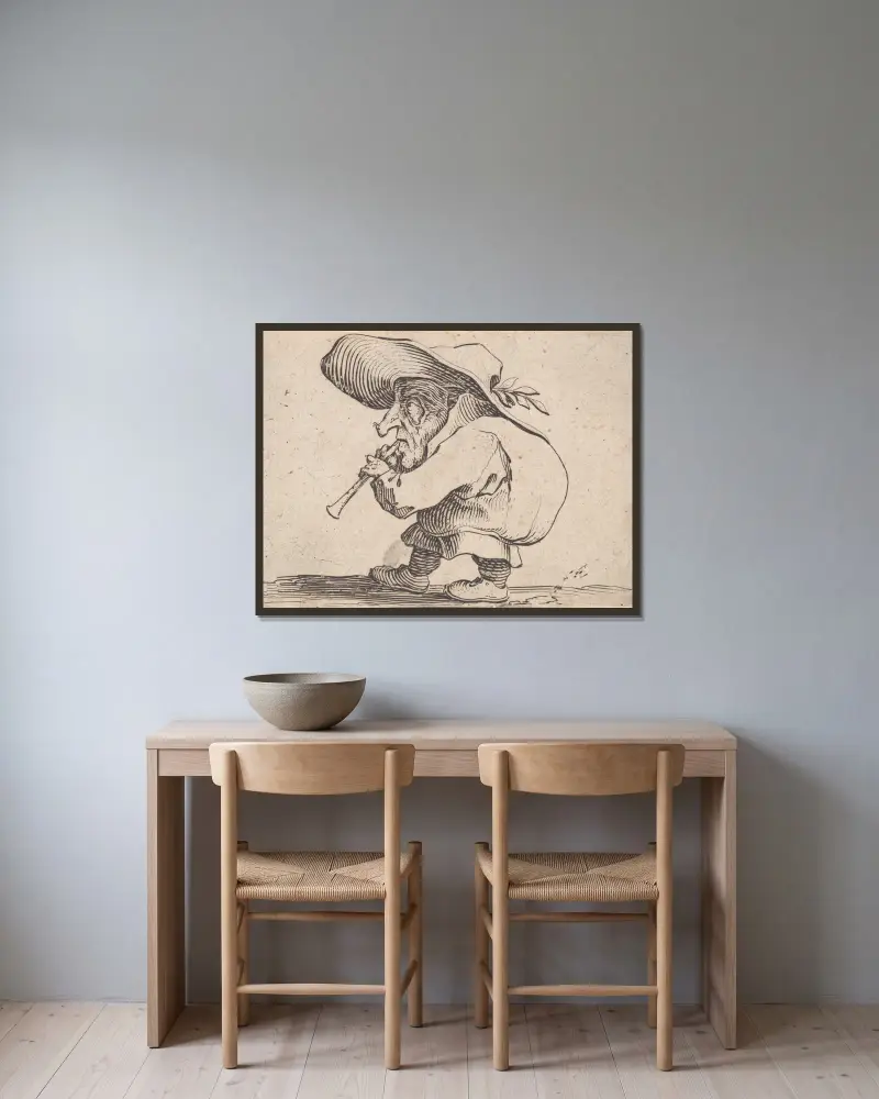 Le joueur de flageolet av Jacques Callot inramad på en vägg