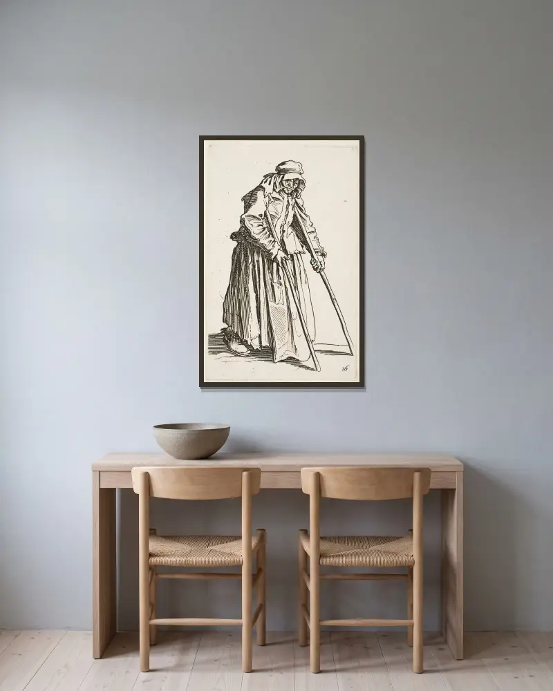 Tiggaren på kryckor av Jacques Callot inramad på en vägg