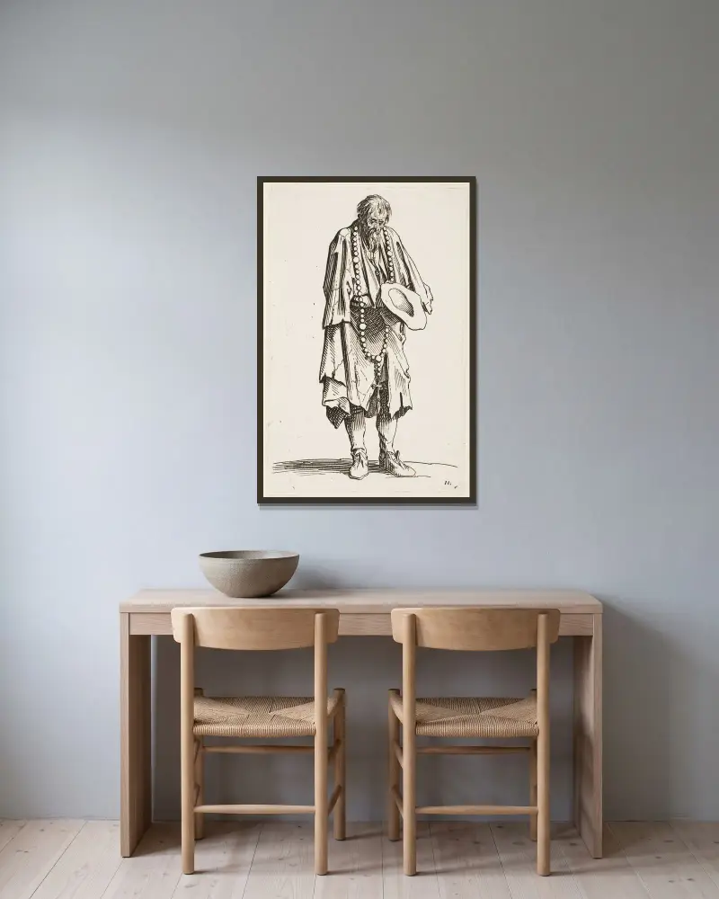 Tiggaren med radbandet av Jacques Callot inramad på en vägg