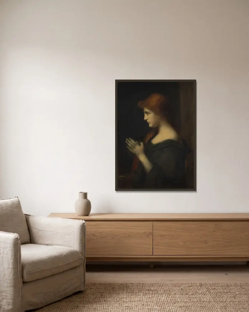 Ung kvinna i bön av Jean-Jacques Henner inramad på en vägg