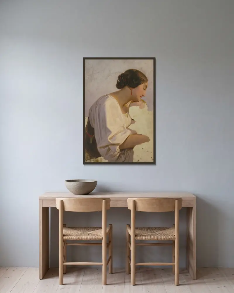 Girl with earrings av Jakob Becker inramad på en vägg
