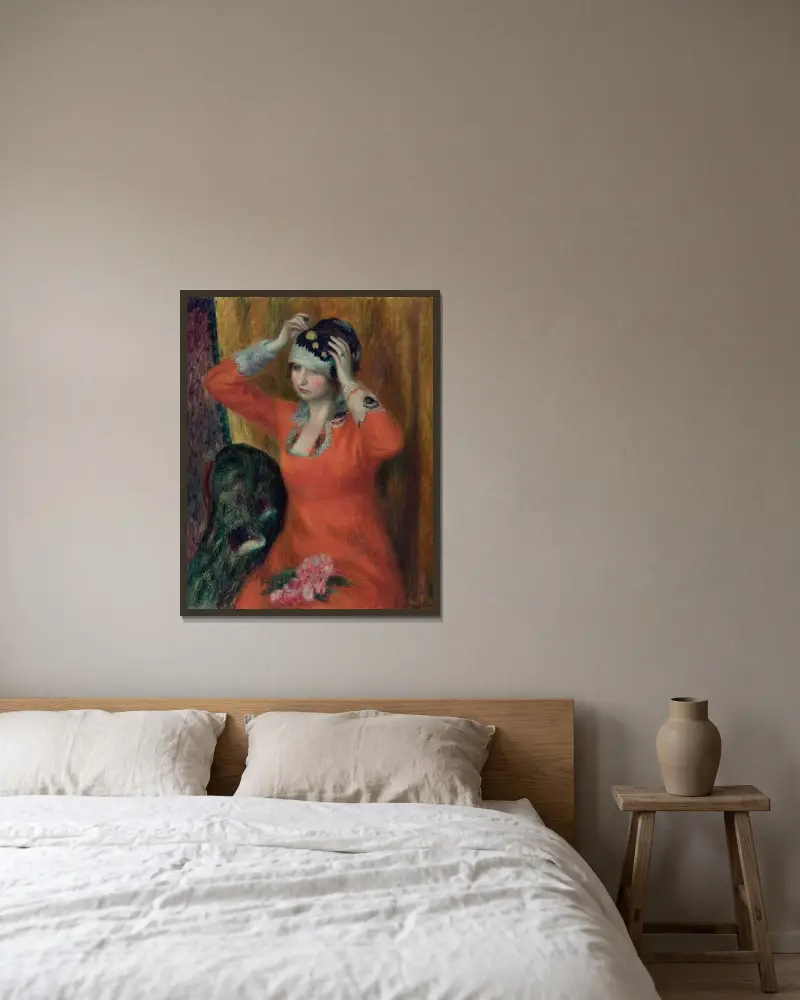 Flicka i röd klänning som fäster en hatt av William James Glackens inramad på en vägg
