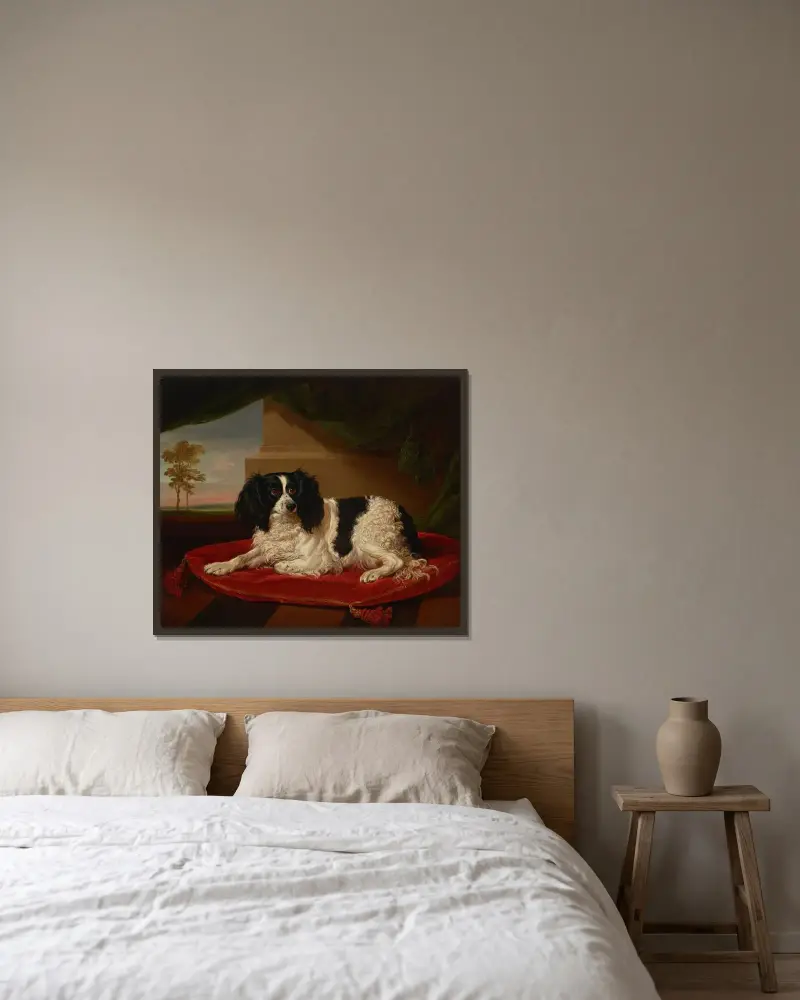 En King Charles-spaniel på en röd kudde av James Ward inramad på en vägg