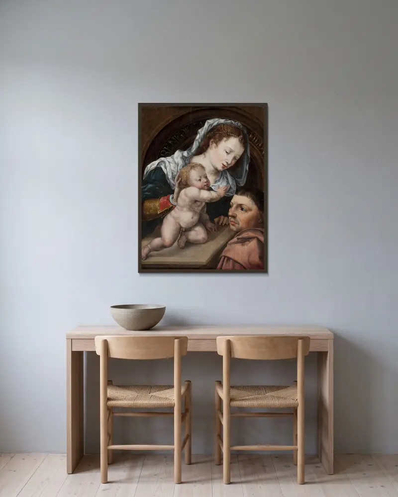 Virgin and Child with a Patron av Jan Gossaert inramad på en vägg