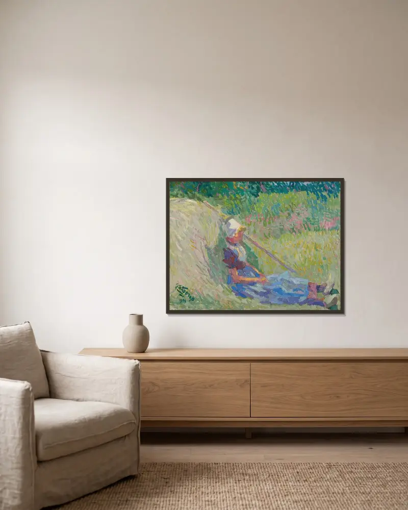 Flicka vilande mot en höstack av Jan Toorop inramad på en vägg