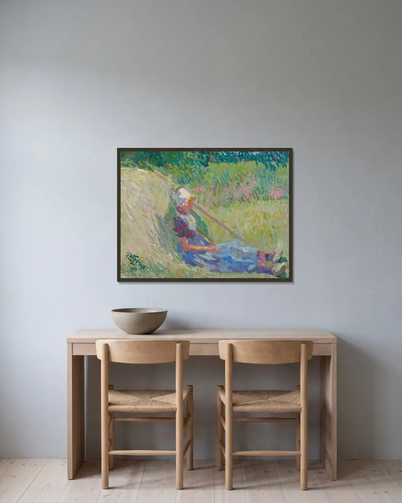 Flicka vilande mot en höstack av Jan Toorop inramad på en vägg