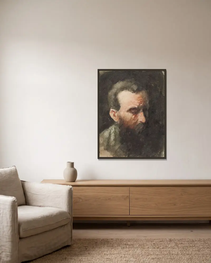 Manshuvud av Jan Toorop inramad på en vägg