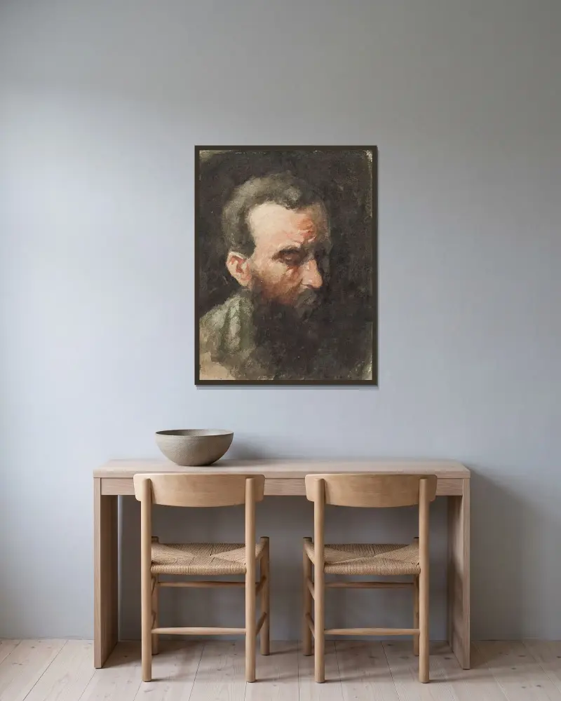 Manshuvud av Jan Toorop inramad på en vägg
